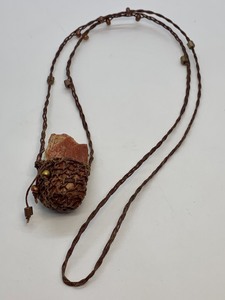 lot 486 image: Folk Art Style Necklace Featuring a Woven Chain and Basket Holding a Small Piece of Petrified Wood