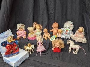 lot 104 image: Group of Small Dolls