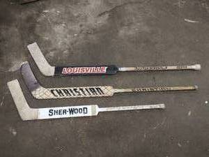 Three Hockey Goalie Sticks
