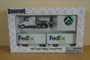 lot 193 image: Signature Series Fed Ex Ground Scale Model Semi and Trailer