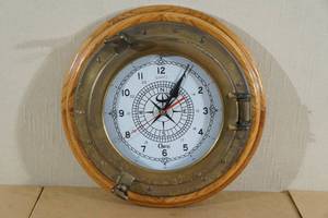 lot 22 image: Oak and Brass Ships Porthole Orvis Clock
