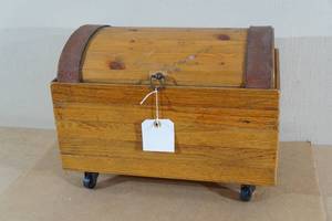 lot 35 image: Leather Strap Wood Trunk on Wheels