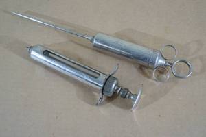 lot 39 image: Antique Large Syringes or Extractors