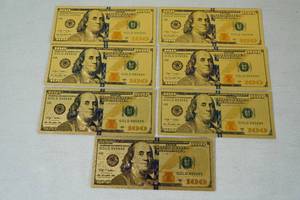 lot 21 image: Gold Foil US $100 Bill Replicas