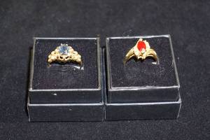 lot 4 image: 2 Gold Tone Rings - Blue, Red Stone