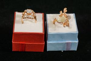 lot 9 image: 2 Rose Gold Tone Rings - Clear Stones