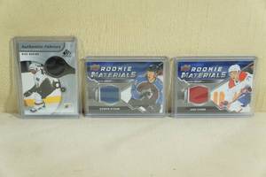 lot 95 image: Hockey Jersey Insert Cards - Modano, Byram, Evans