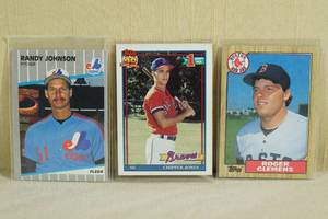 lot 94 image: Baseball Cards - Randy Johnson RC, Chipper Jones RC, 1987 Clemens