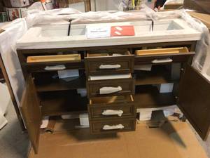 lot 11 image: Aiken 60 in. W x 22 in. D Bath Vanity in Almond Latte with Cultured Marble Vanity Top in White with white Basins by Home Decorators Collection open box retail $2000.00