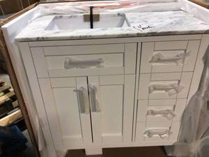 lot 12 image: Riverdale 36 in. W x 21 in. D Vanity in White with a Carrara Marble Vanity Top in White with white Sink by Home Decorators CollectionBroken on Granite Top Customer Returns See Pictures