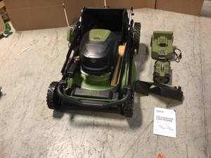 lot 21 image: 62V Cordless 3-in-1 High Wheel Push Walk Behind Mower, Brushless 22 In. Cutting Width with 4Ah Battery and Rapid Charger by Green Machine Customer Returns See Pictures
