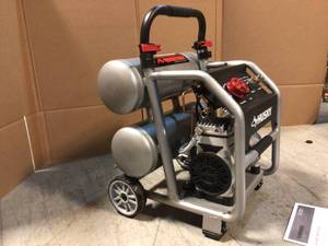 lot 24 image: 4.5 Gal. Portable Electric-Powered Silent Air Compressor by Husky Customer Returns See Pictures