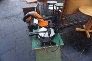 lot 10 image: Chicago Electric Model 4168 10 Compound Slide Miter Saw Mounted On Wood Table
