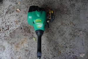 lot 14 image: Weed Eater Feather Lite Model FL25C Gas Powered Weed Trimmer