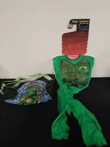 lot 23 image: Teenage Mutant Ninja Turtles Duffle Bag and Vinyl Costume