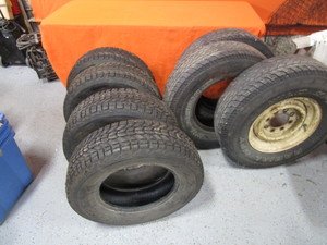 lot 80 image: Set of 21570 R15 Studded Snow Tires & (3) LT23585 R16 Tires w(1) 8 Hole Wheel