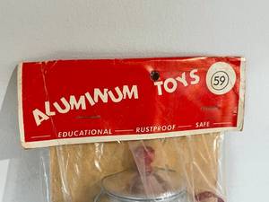 lot 38 image: Vintage Aluminum Dishes Toy Set in Original Package