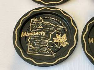 lot 86 image: Eight 1950s Minnesota Tin Coasters
