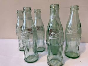 lot 102 image: 6 Classic Coca-Cola Glass Bottles