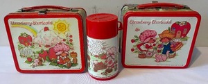 lot 142 image: 2 Strawberry Shortcake Lunch Boxes With One Having a Thermos