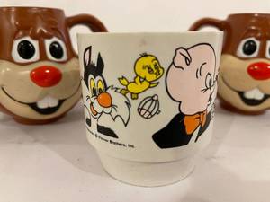 lot 365 image: Two Vintage Nestles Cups and One Warner Brothers