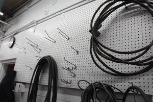 Peg Board Wall Storage System  with Hoses and Cords