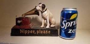 lot 119 image: Iron RCA Nipper Bank and Animated Music Box