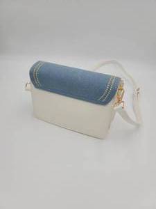 lot 49 image: BLUE AND WHITE PURSE