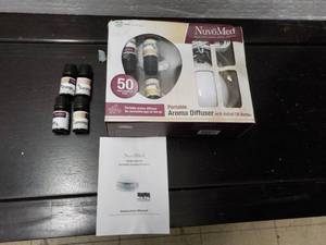 lot 105 image: Nuvo Med Portable Aroma Diffuser an...