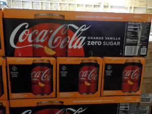 lot 296 image: 4 - 12 pkgs Coca Cola Orange Vanill...