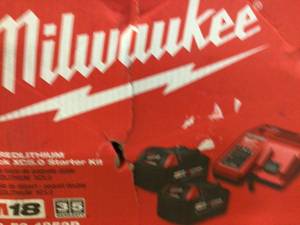 lot 8 image: Milwaukee M18 18-Volt Lithium-Ion XC Starter Kit with (2) 5.0Ah Batteries, Charger & Contractor Bag Customer Returns See Pictures