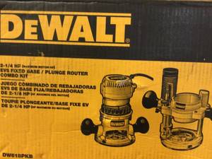 lot 43 image: DEWALT 12 Amp Corded 2-14 Horsepower Fixed and Plunge Base Router Kit Customer Returns See Pictures