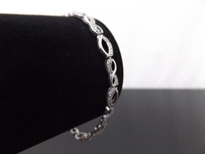 lot 43 image: .925 Sterling Silver Diamond Accented Infinity Bracelet