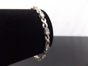 lot 44 image: .925 Sterling Silver Zirconia Hugs and Kisses Bracelet