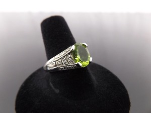 lot 64 image: .925 Sterling Silver Diamond Accented Oval Cut Peridot Ring Size 8.5