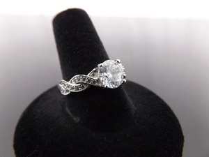 lot 77 image: .925 Sterling Silver Faceted Zirconia Ring Size 9