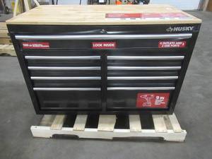 lot 235 image: HUSKY 46 in. W x 24 in. D 9-Drawer Gloss Black Deep Tool Chest Mobile Workbench with Hardwood Top - Dented top front. Lock Damaged - Does not work - Top drawer sticks, but opens.