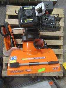 lot 9 image: YARDMAX 22 in. 2-Stage Gas Snow Blower YB5765 - Missing Parts - WheelsHandle maybe more. Has Compression - Couldnt start. For PartsRestore.