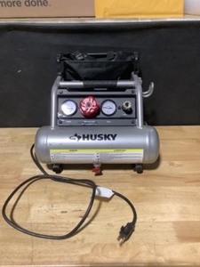 lot 18 image: Husky 1 Gal. Portable Electric-Powered Silent Air Compressor See Pictures