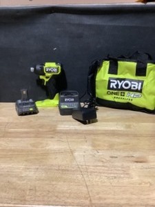 lot 29 image: RYOBI ONE HP 18V Brushless Cordless Compact 14 in. Impact Driver Kit with (2) 1.5 Ah Batteries, Charger and Bag See Pictures