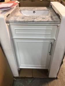 lot 7 image: Aberdeen 24 in. W x 20 in. D Bath Vanity in White with Carrara Marble Top with White Sink by Home Decorators Collection Customer Returns See Pictures
