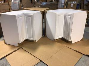 lot 23 image: Lot of 2 Designer Series Elgin Assembled 33x34.5x20.25 in. Lazy Susan Corner Base Kitchen Cabinet in White by Hampton Bay Customer Returns See Pictures