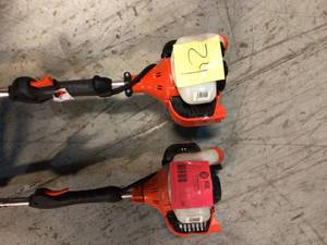 lot 24 image: 21.2 cc Gas 2-Stroke Cycle Curved Shaft Trimmer by ECHO Customer Returns See Pictures