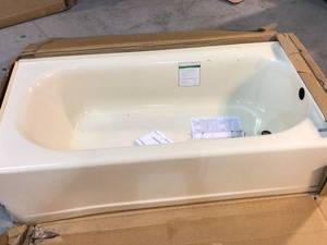 lot 31 image: Princeton 60 in. Right Hand Drain Rectangular Alcove Bathtub in Bone by American Standard Customer Returns See Pictures
