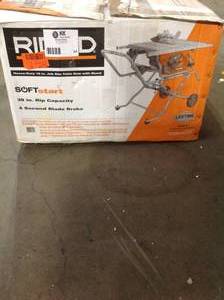 lot 24 image: RIDGID 10 in. Pro Jobsite Table Saw with Stand R4514 in good condition see pictures