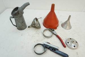 lot 238 image: funnels and oil wrenches