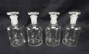 lot 81 image: Set of 4 Vintage Mercer Glass Works Merco 125 ML Clear Flint Glass Flat Top Grooved Stopper Dropping Bottles