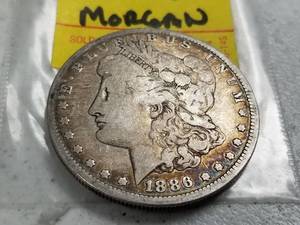 lot 50 image: 1886-O MORGAN SILVER DOLLAR