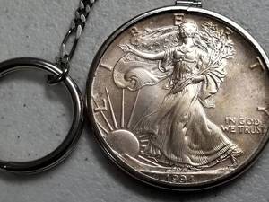 lot 58 image: 1994 AMERICAN SILVER EAGLE 1 TROY OZ .999 FINE SILVER ON KEYCHAIN