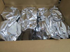 lot 105 image: Case of 8 Bags Red Apple Flavored P...